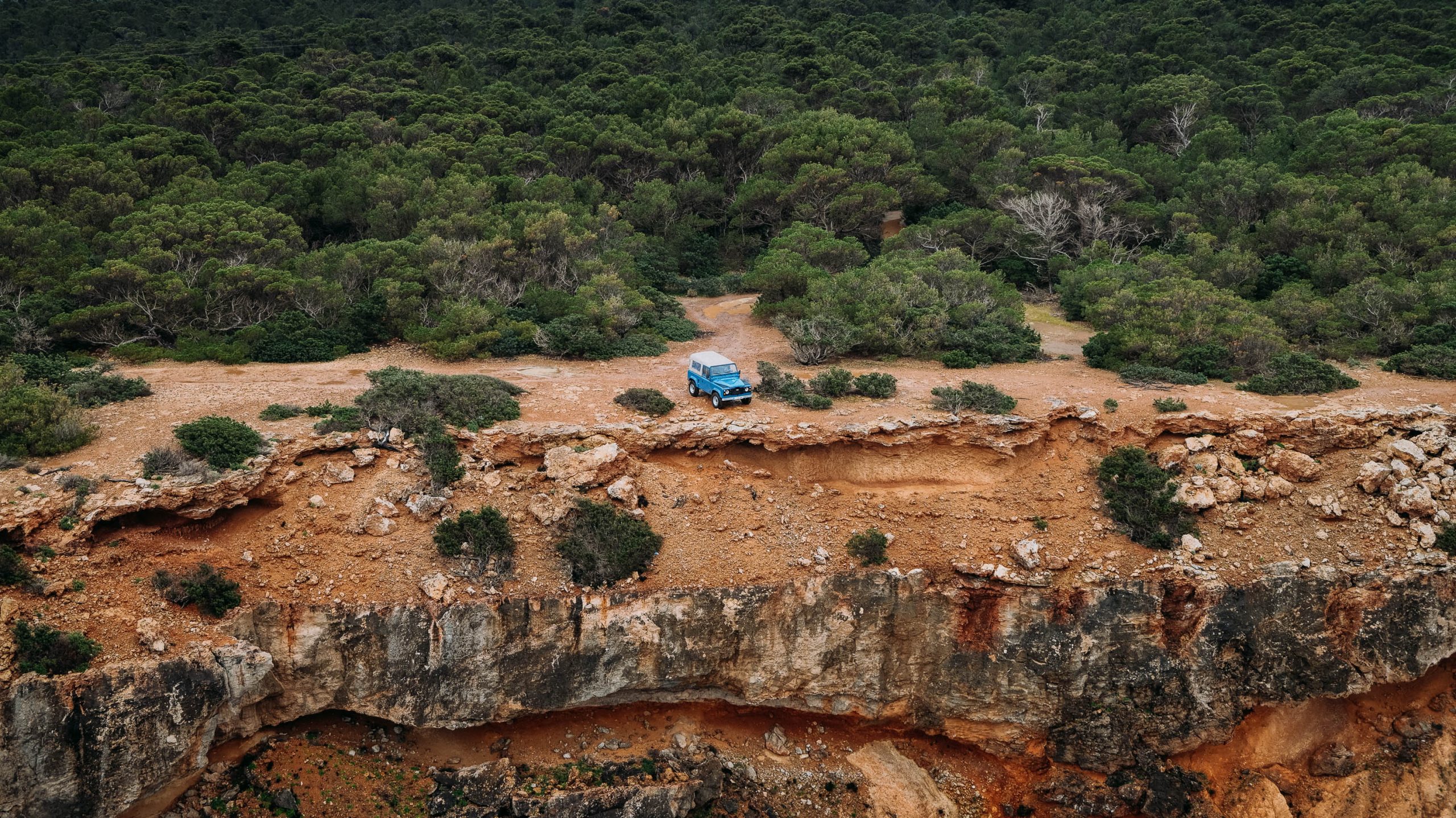 Land Rover Defender driving through hidden roads in Ibiza